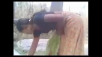 Stepmother secretly having sex with her boyfriend in the woods in an Indian village