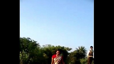 Desi village bhabhi lifts her saree to show her pussy in public space
