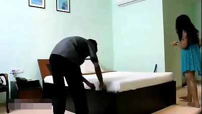 An Indian housewife in blue lingerie seduces a young hotel staff member who brings her room service.
