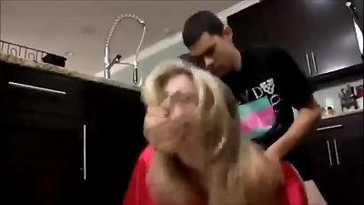 A young man has sex with his attractive mother in the kitchen