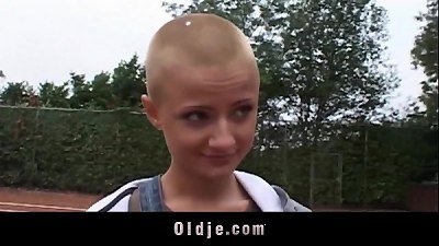 A stunning young woman with short hair gives her grandfather oral sex