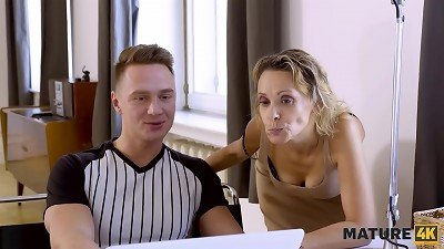 A mature beauty invites a repairman to have some hot sex with a hung stud.