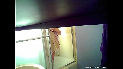 A son installs a hidden camera in the shower to see his motherâ€™s big breasts.